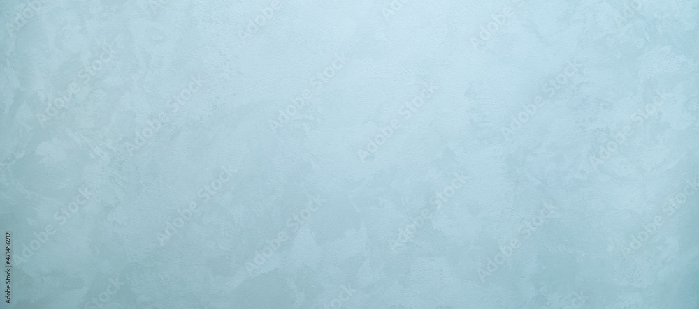 The texture of decorative plaster under silk. Abstract gray-blue mother-of-pearl background with space for text The texture of decorative plaster under silk. Abstract gray-blue mother-of-pearl background with space for text