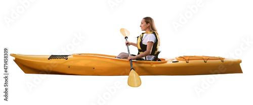 Beautiful young woman with paddle in kayak on white background