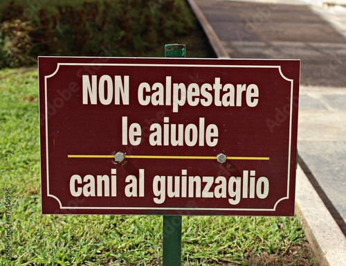 Italy: Road signal (Do not step on the flower beds, dogs on a leash).