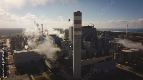 Aerial view of industry metallurgical plant dawn smoke smog emissions pollution climate change and global warming concept