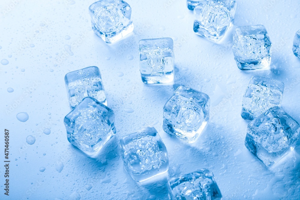 Top view. Ice cubes with water drops scattered on a background. Top view. Ice cubes with water drops scattered on a background.