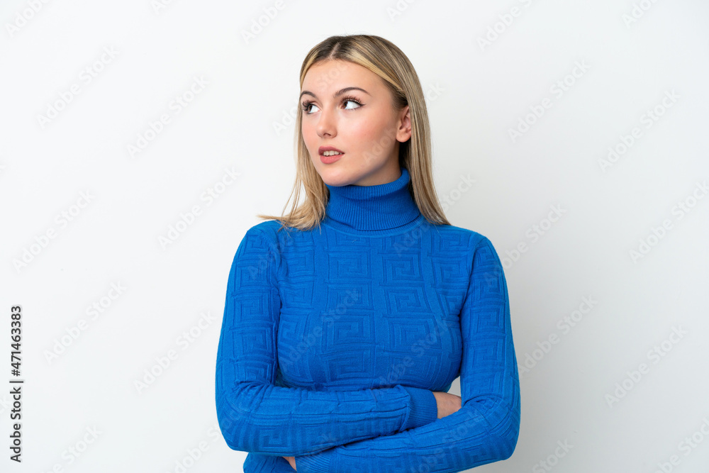 Young caucasian woman isolated on white background looking to the side Young caucasian woman isolated on white background looking to the side
