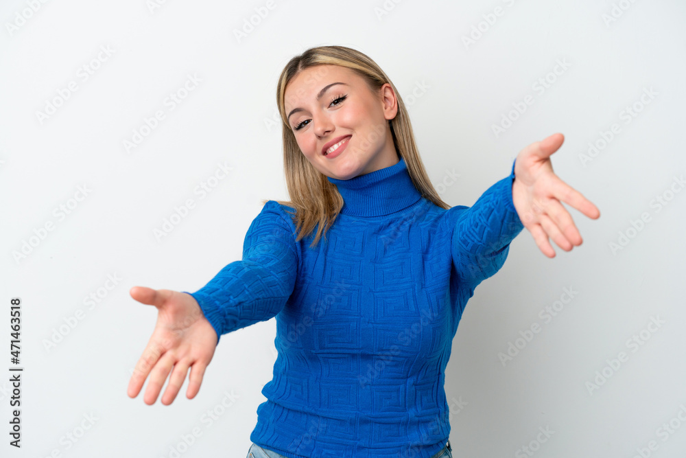 Young caucasian woman isolated on white background presenting and inviting to come with hand Young caucasian woman isolated on white background presenting and inviting to come with hand