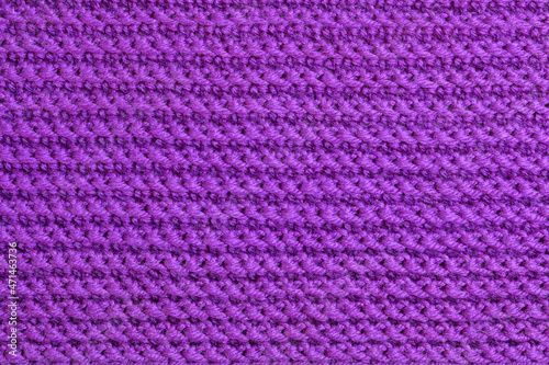 Texture of knitted wool textile. Velvet violet