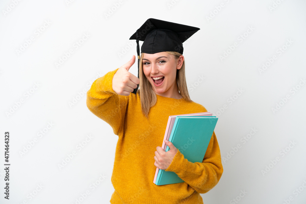 Young student caucasian woman isolated on white background with thumbs up because something good has happened Young student caucasian woman isolated on white background with thumbs up because something good has happened