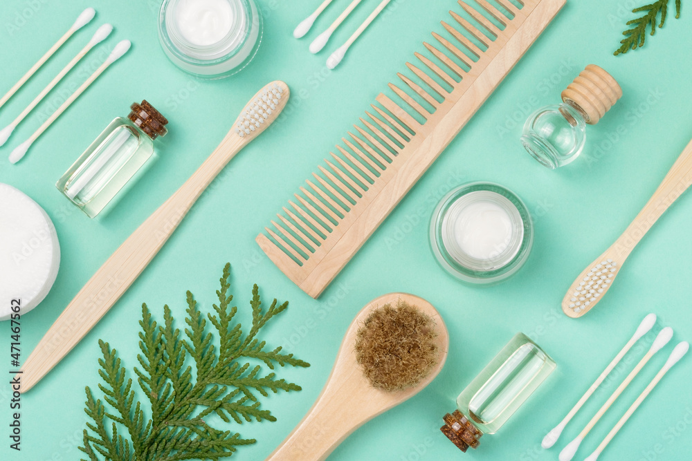 Organic cosmetics for skin care. Cotton swabs, face cream, wooden comb, face serum, essential oil, toothbrush. Zero waste concept. View from above. Organic cosmetics for skin care. Cotton swabs, face cream, wooden comb, face serum, essential oil, toothbrush. Zero waste concept. View from above.