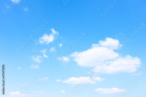 Blue sky with rare white clouds