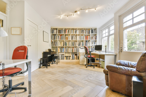 Large cozy living room with a large wall-to-wall library photo