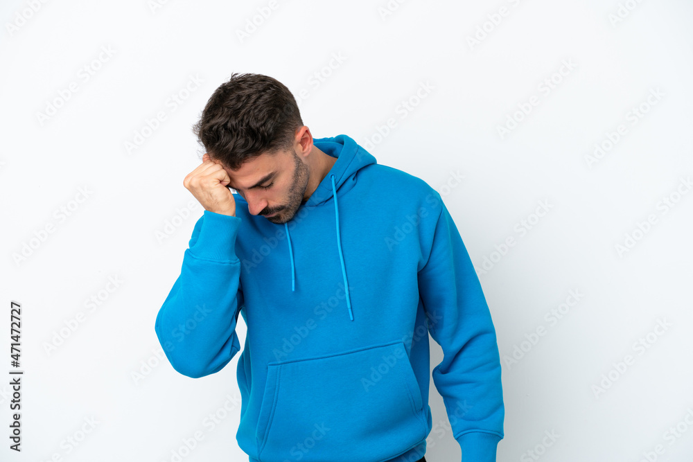 Young caucasian man isolated on white background with headache