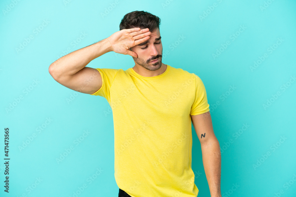Young caucasian man isolated on blue background with tired and sick expression Young caucasian man isolated on blue background with tired and sick expression