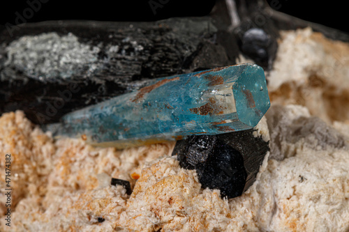 Macro stone mineral tourmaline aquamarine with a black background