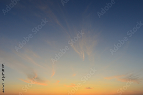 Beautiful Vivid sky painted by the sun leaving bright golden shades.Dense clouds in twilight sky in winter evening.Image of cloud sky on evening time.Evening Vivid sky with clouds.