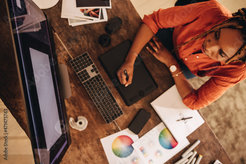 Freelancer working at her creative workstation photo