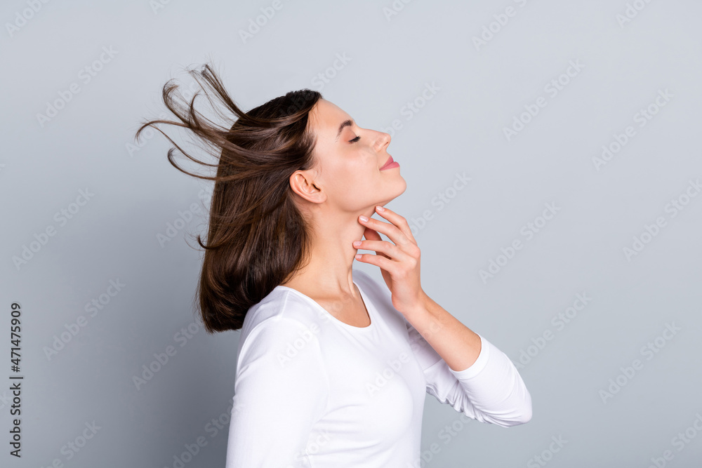 Profile photo of cool brunette millennial lady touch skin wear white jumper isolated on grey color background Profile photo of cool brunette millennial lady touch skin wear white jumper isolated on grey color background