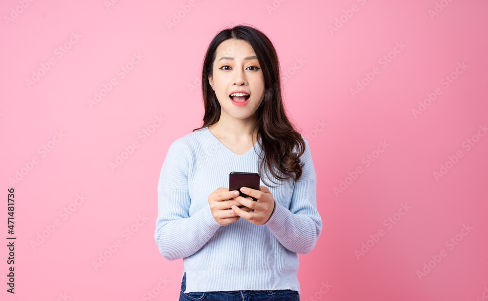 Portrait of a beautiful young Asian girl, isolated on pink background Portrait of a beautiful young Asian girl, isolated on pink background