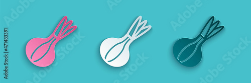 Paper cut Onion icon isolated on blue background. Paper art style. Vector