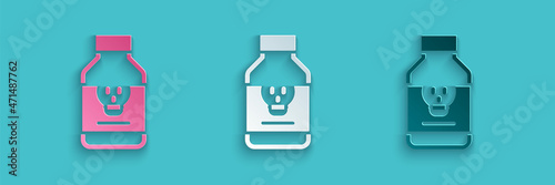 Paper cut Poisoned pill icon isolated on blue background. Pill with toxin. Dangerous drug. Paper art style. Vector