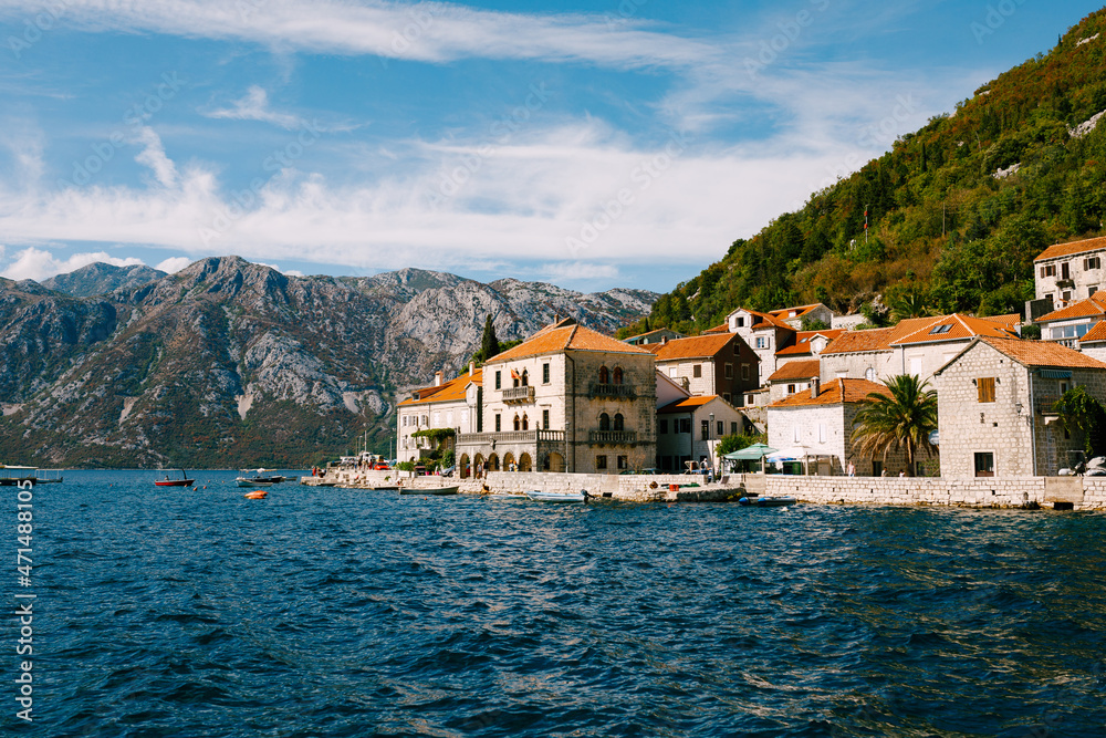 Houses with red tiled roofs on the banks of Perast. Montenegro