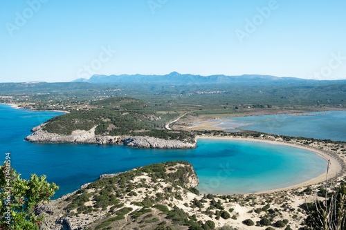 Beautiful sandy beach, bay landscape, lagoon Voidokilia beach in Greece,outside Pylos, Peloponnese, Ionic sea.Top view from Navarino castle.Beauty of nature.Copy space