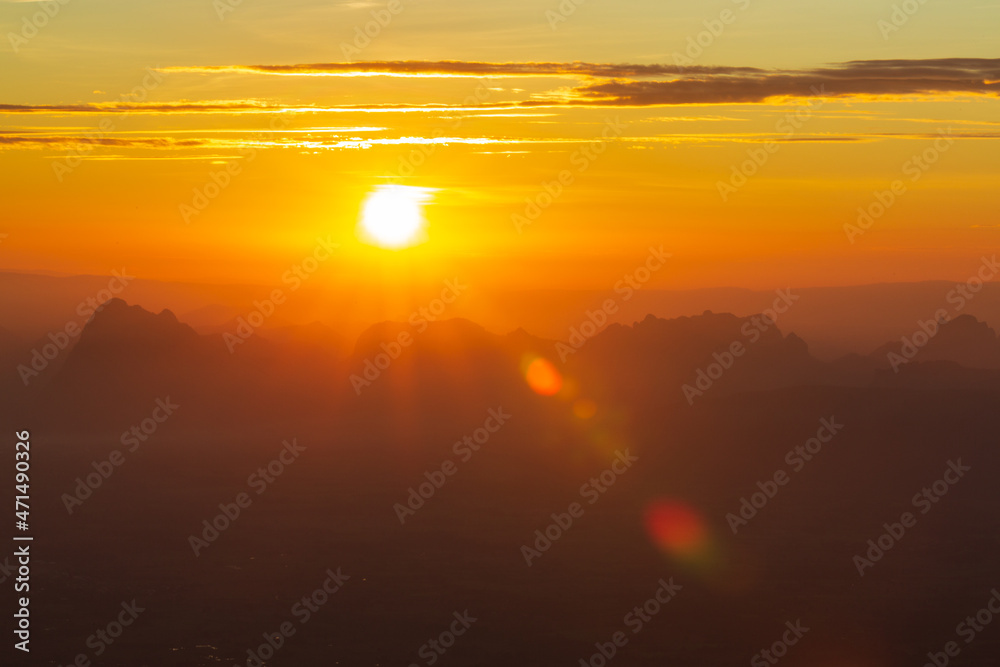 Glowing sunrise shines over mountain range. Glowing sunrise shines over mountain range.