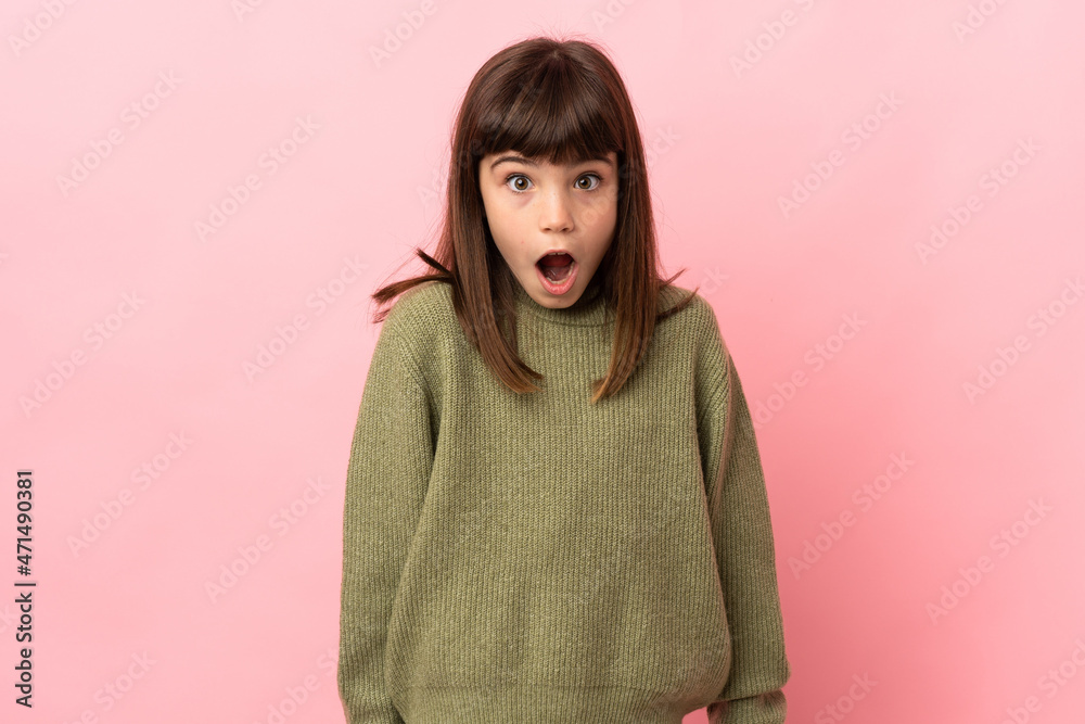 Little girl isolated on pink background with surprise facial expression Little girl isolated on pink background with surprise facial expression