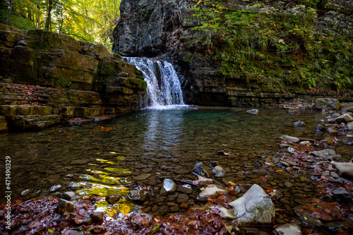 Beautiful waterfall among the canyon in the Carpathian mountains. Manyavsky waterfall. photo