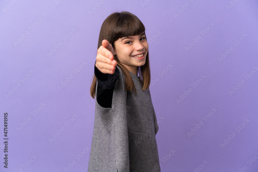 Little girl over isolated background shaking hands for closing a good deal Little girl over isolated background shaking hands for closing a good deal