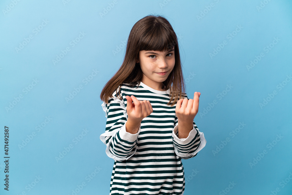 Little girl over isolated background making money gesture Little girl over isolated background making money gesture