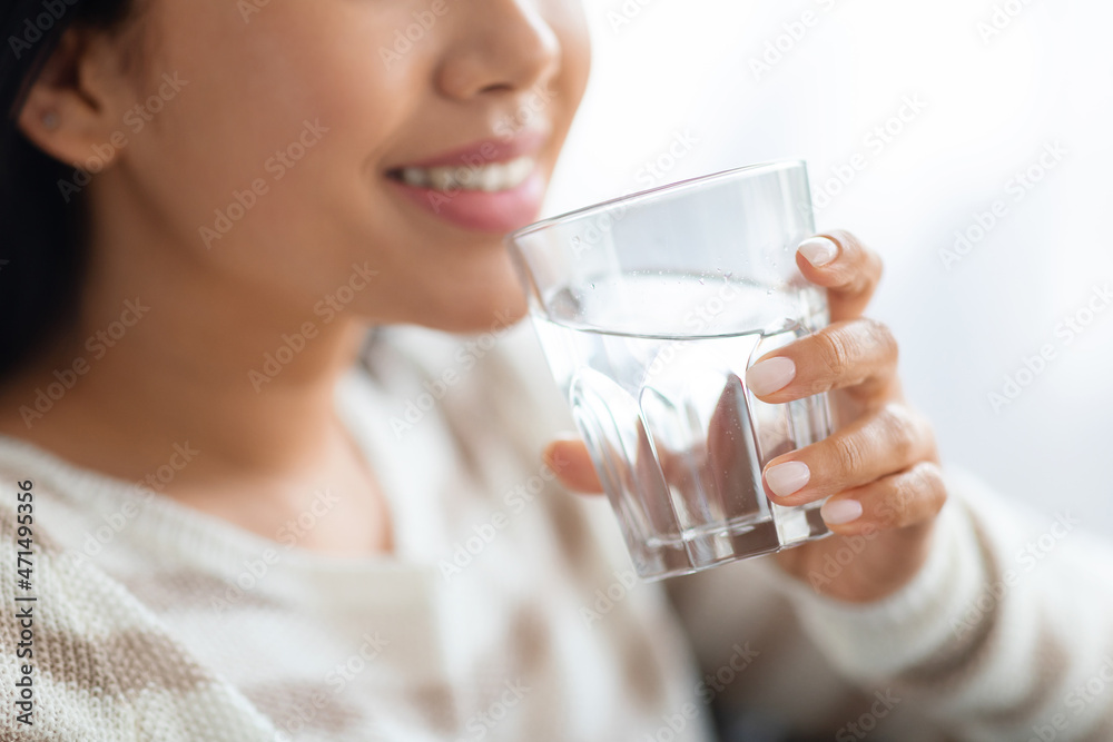Hydration Concept. Closeup Shot Of Smiling Young Lady Drinking Water From Glass Hydration Concept. Closeup Shot Of Smiling Young Lady Drinking Water From Glass