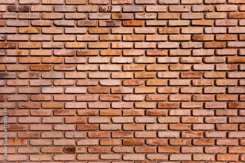 Brick wall with red bricks.
