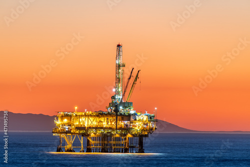 Offshore oil platform at dusk.