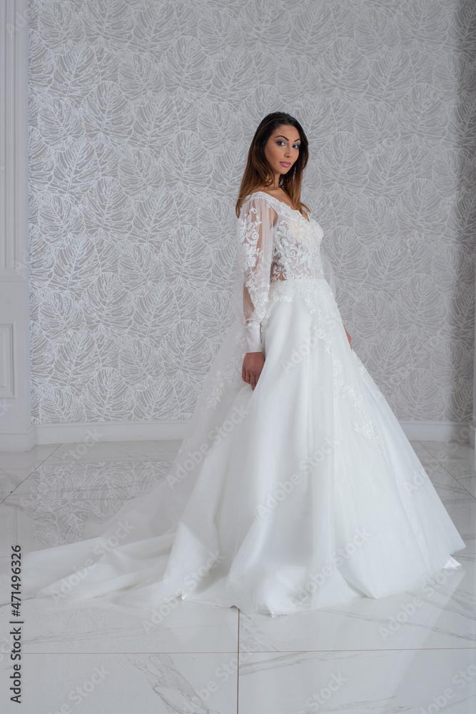 Fototapeta premium Girl with wedding dress posing for photo shoot