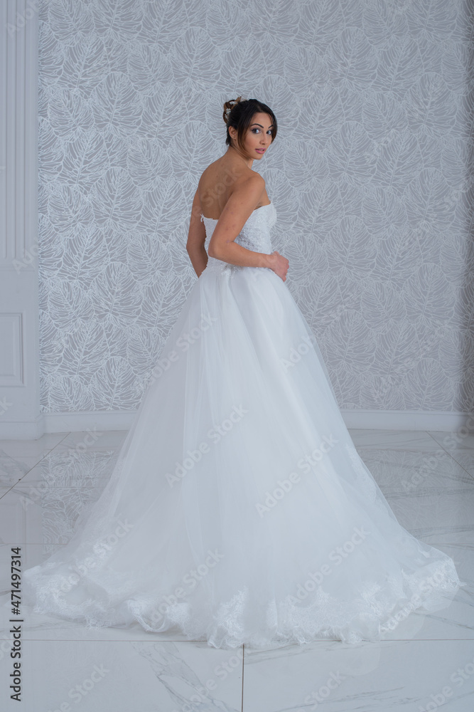 Girl with wedding dress posing for photo shoot Girl with wedding dress posing for photo shoot