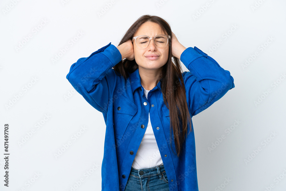 Young Ukrainian woman isolated on white background frustrated and covering ears Young Ukrainian woman isolated on white background frustrated and covering ears