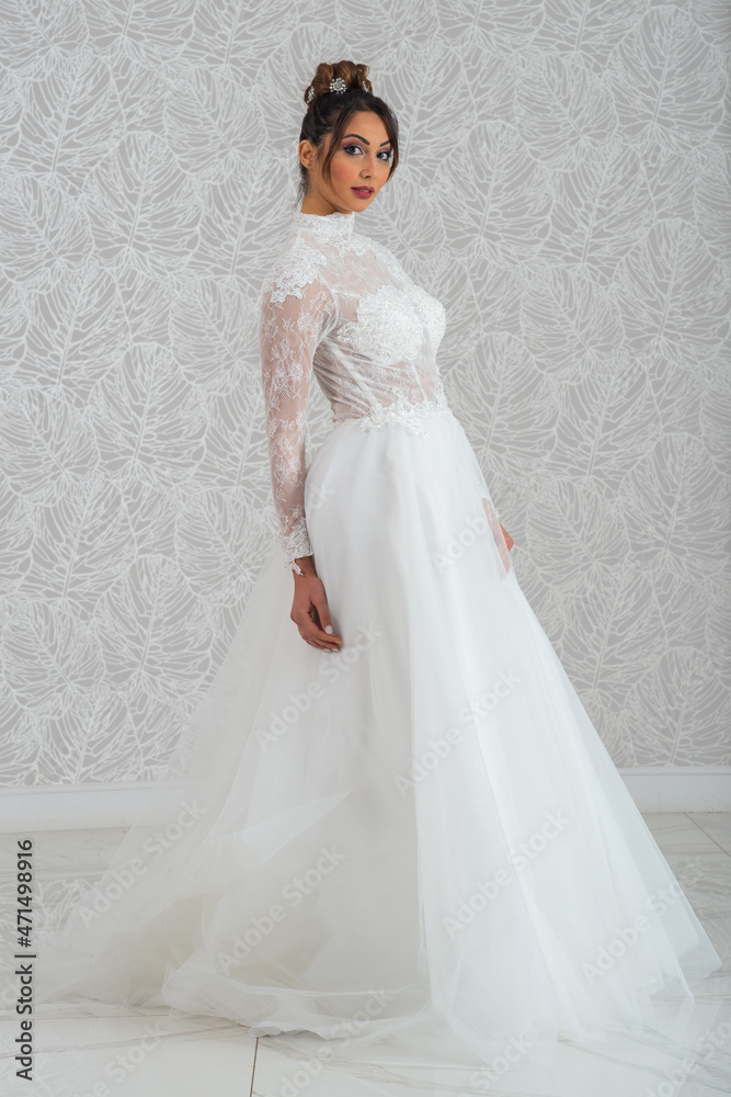 Fototapeta premium Girl with wedding dress posing for photo shoot