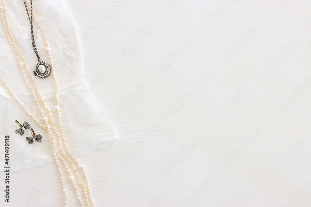 Background of white delicate lace fabric and pearls Background of white delicate lace fabric and pearls