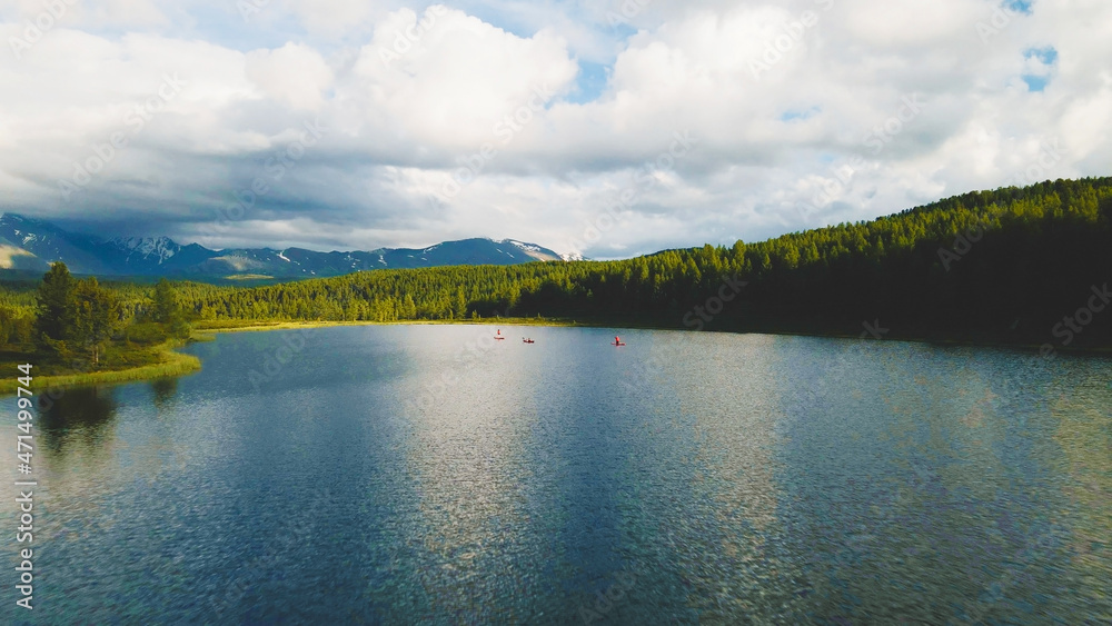 People kayaking on the crystal water lake. Aerial footage People kayaking on the crystal water lake. Aerial footage