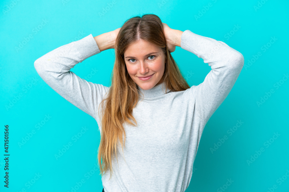 Young blonde woman isolated on blue background laughing