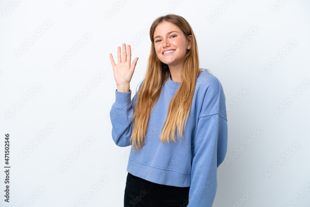 Young blonde woman isolated on white background saluting with hand with happy expression Young blonde woman isolated on white background saluting with hand with happy expression