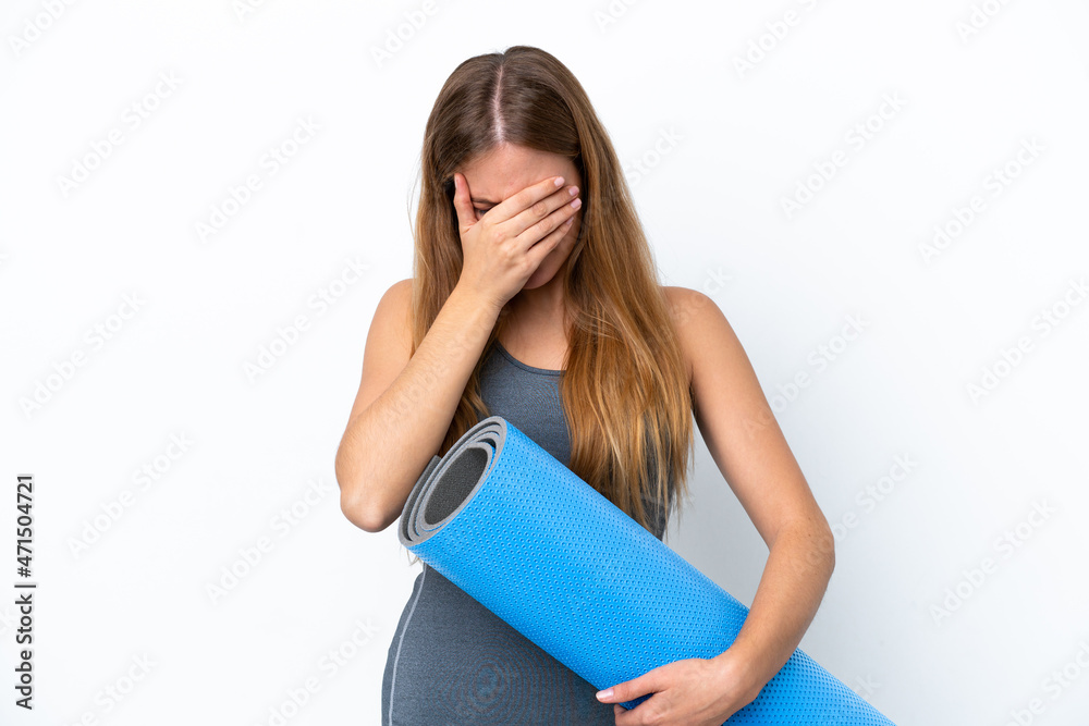 Young sport woman going to yoga classes while holding a mat with tired and sick expression Young sport woman going to yoga classes while holding a mat with tired and sick expression
