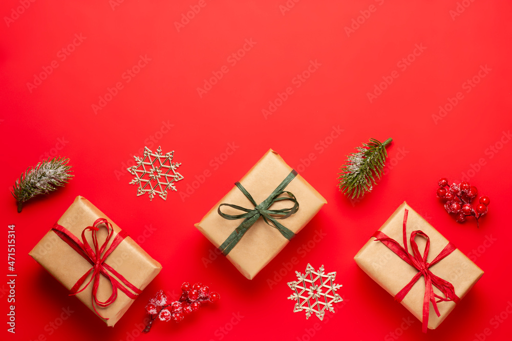 Christmas composition with decorations and ornametns on red background Christmas composition with decorations and ornametns on red background