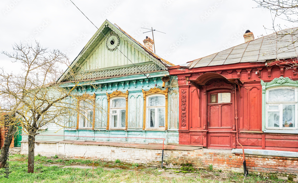 Wooden house in the traditional Russian style with carved platbands
