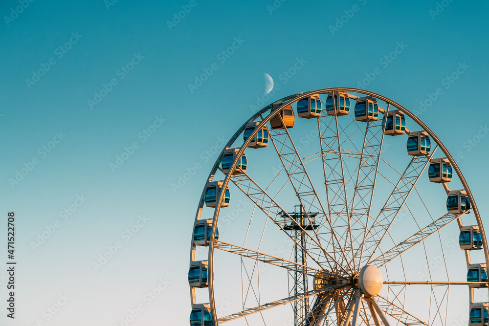 Helsinki, Finland. Moon Rising Over Ferris Wheel.