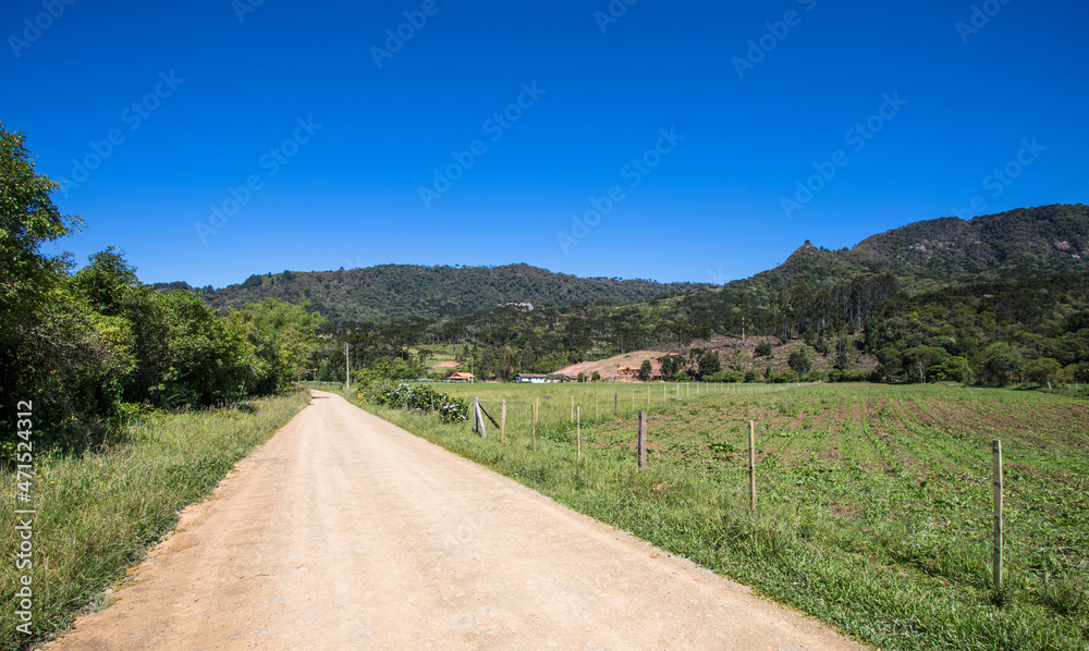 Rural area with dirt road in southern Brazil.