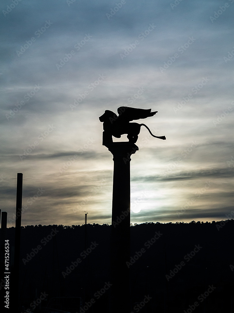 Winged lion symbol of Venice against the light-Salò-Garda lake-Italy