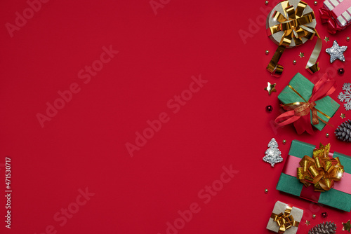 Christmas pattern made of holiday accessories on red background. Preparation for Christmas Eve