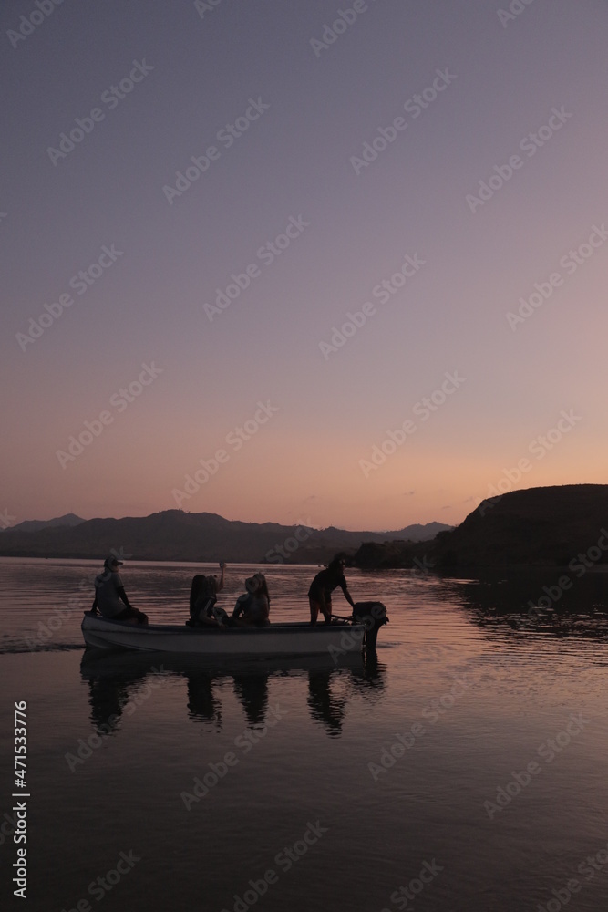 A tender boat driver will take the tourists back to the ship after enjoying the sunset on Gili Laba Island, Labuan Bajo