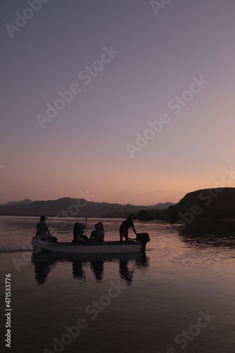 A tender boat driver will take the tourists back to the ship after enjoying the sunset on Gili Laba Island, Labuan Bajo