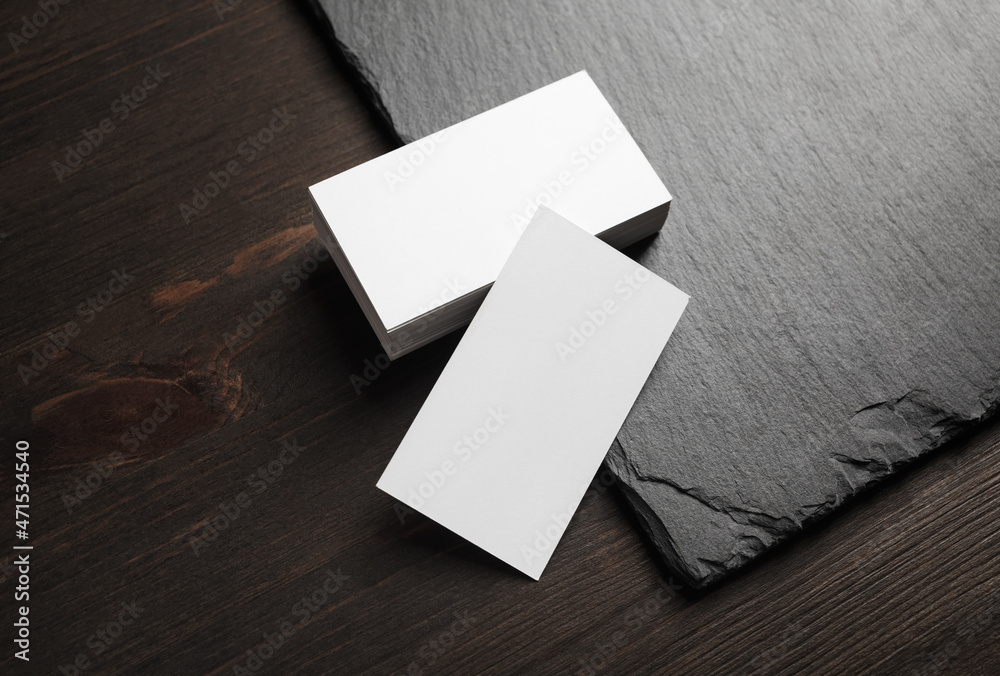 Blank white business cards on stone board background. Copy space. Blank white business cards on stone board background. Copy space.