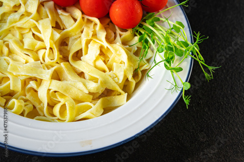 pasta cream sauce fettuccine or tagliatelle macaroni meal snack on the table copy space food background rustic. top view